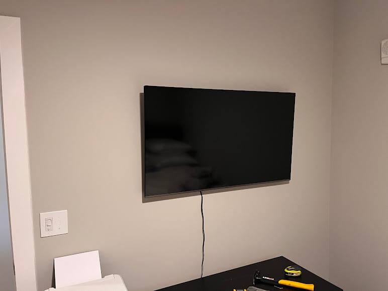 Wall-mounted television in a room