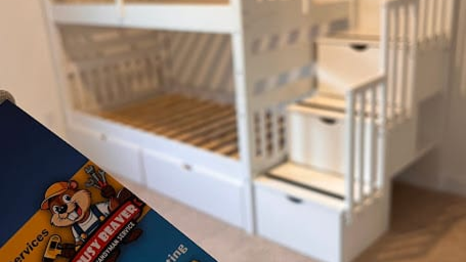 Professional Busy Beaver handyman assembling a modern dresser for a furniture assembly project in a Charlotte, NC home.