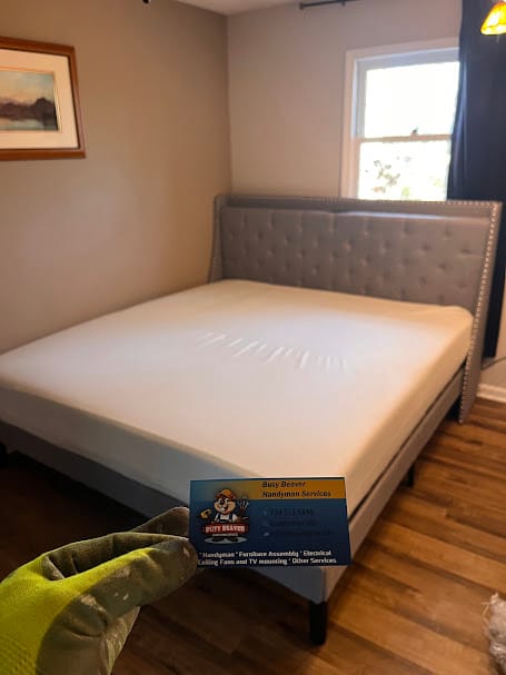 A perfectly assembled gray tufted upholstered bed frame with mattress, installed by a top-rated IKEA furniture assembly company in Charlotte, NC.