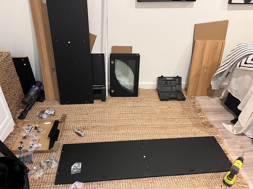 Behind-the-scenes look at furniture assembly projects in Charlotte, featuring organized hardware and components ready for professional installation.