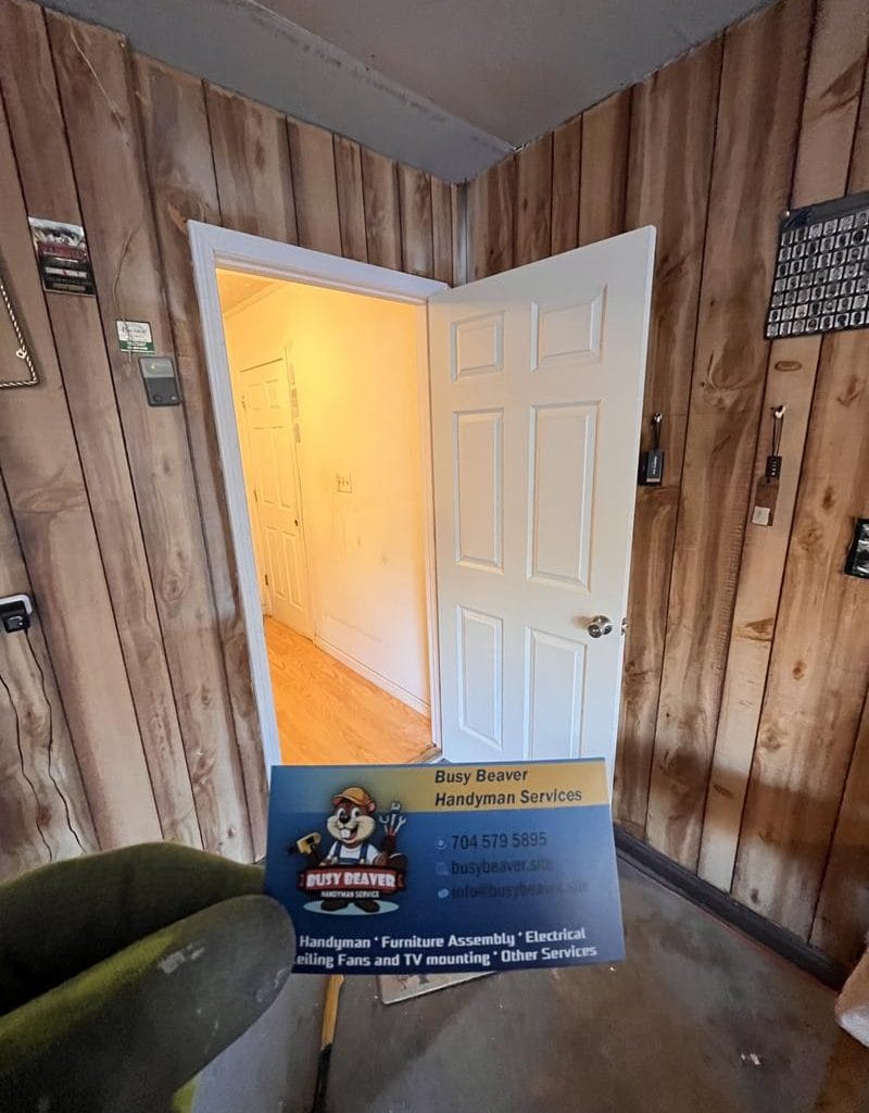 Open door with handyman services card